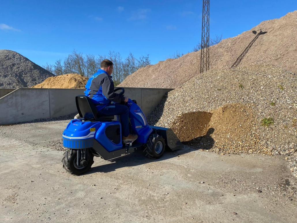 MultiOne mini loader 1 series with bucket moving gravel