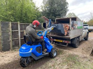 MultiOne mini loader 1 series with fork lifting wood logs