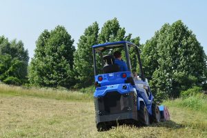 MultiOne mini loader 6 series back with flail mower rear