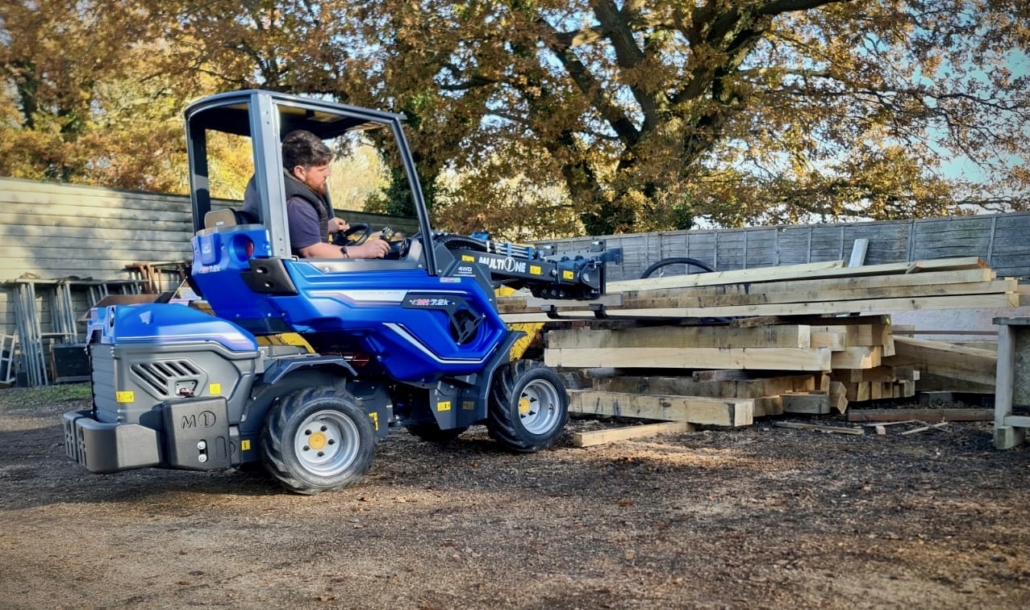 MultiOne mini loader 7.2k with pallet fork lifting wooden logs
