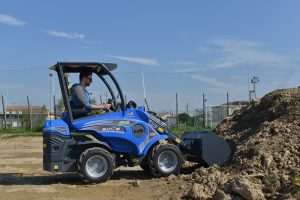 EZ5 with bucket moving soil