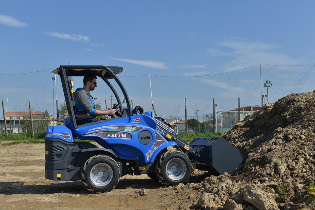 EZ5 with bucket moving soil