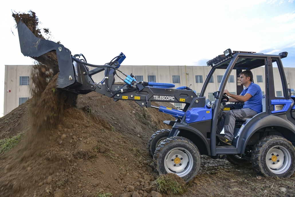 combo bucket on a little soil mountain