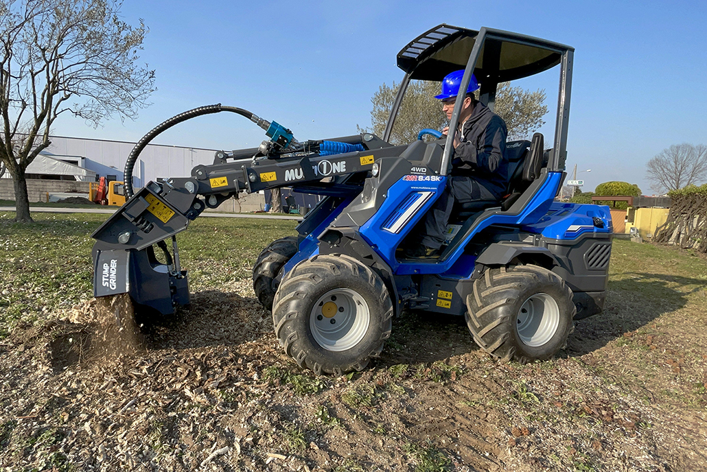 stump grinder in action on a field