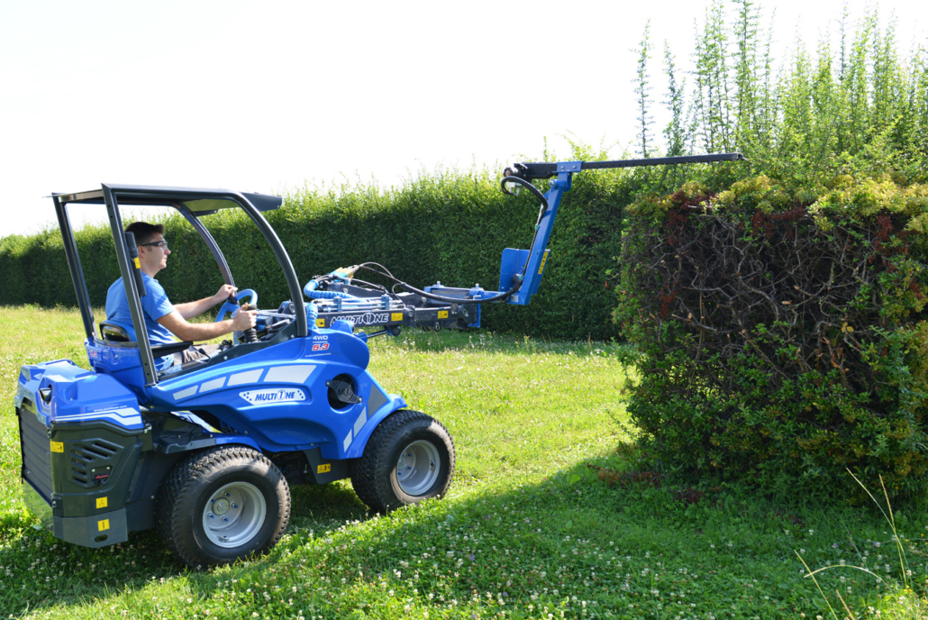 hedge trimmer trimming hedges