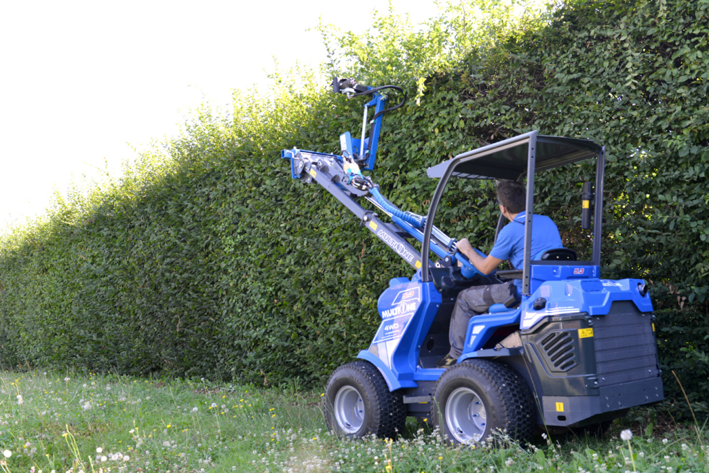 hedge trimmer in action seen from behind