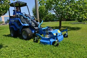 lawn mower in action in a garden