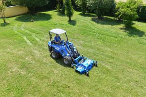 lawn mower seen from far above in a garden