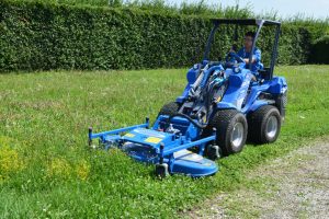 man driving a lawn mower seen from the front