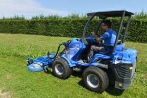 man driving a lawn mower