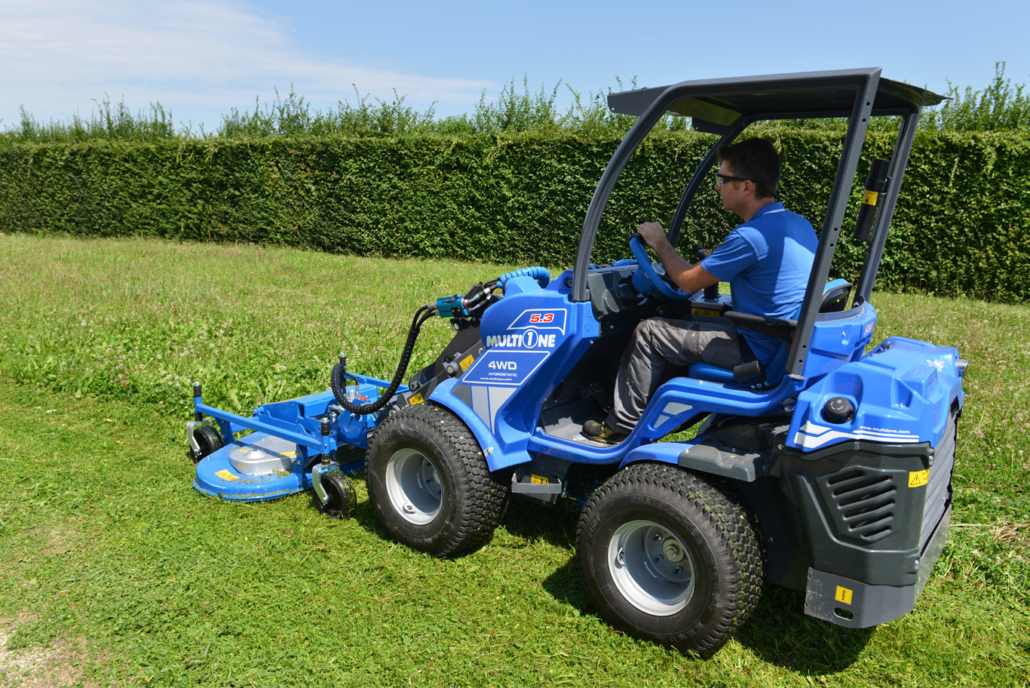 man driving a lawn mower