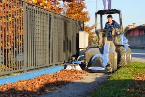 leaf vacuum cleaning a street side