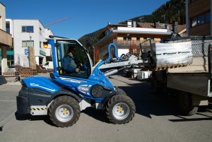 pallet fork lifting a heavy weight with its mechanical boom