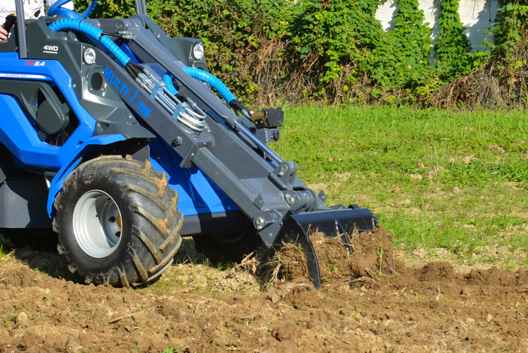 detail of a ripper moving the soil