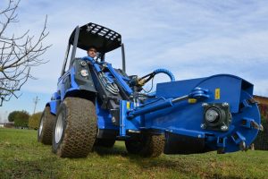 swing stump grinder seen from below
