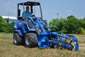 trencher in action on a field