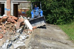 tilt adapter with bucket moving debris